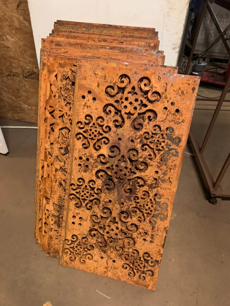 Outdoor metal privacy screen panels in rusted steel with ornate scrollwork, Rustica Ornamentals on Tampa Home & Garden Store