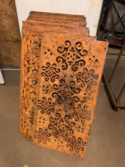 Outdoor metal privacy screen panels in rusted steel with ornate scrollwork, Rustica Ornamentals on Tampa Home & Garden Store