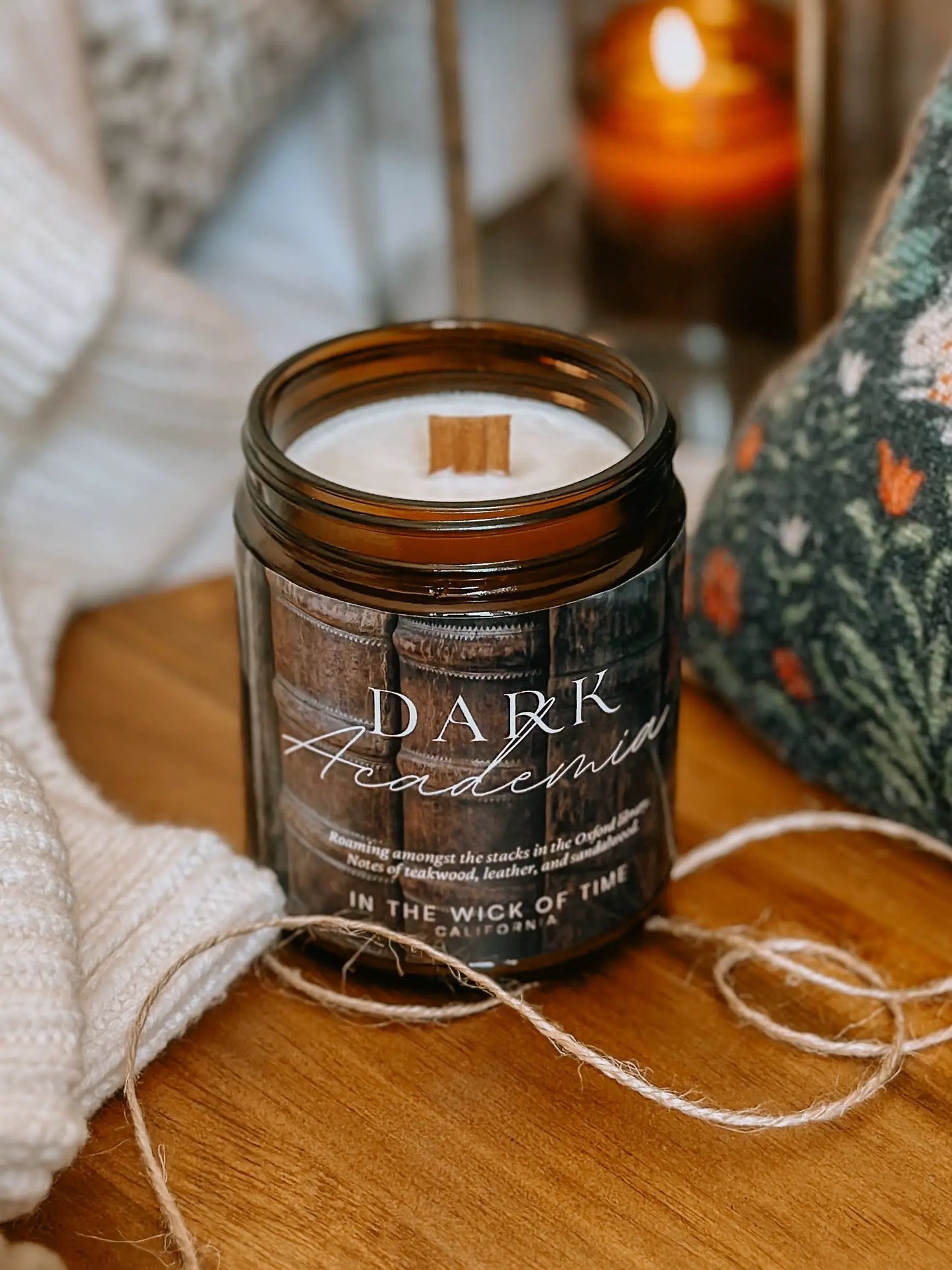 Dark Academia Candle by In the Wick of Time in a brown glass jar with a cinnamon stick on white wax on Tampa Home & Garden Store