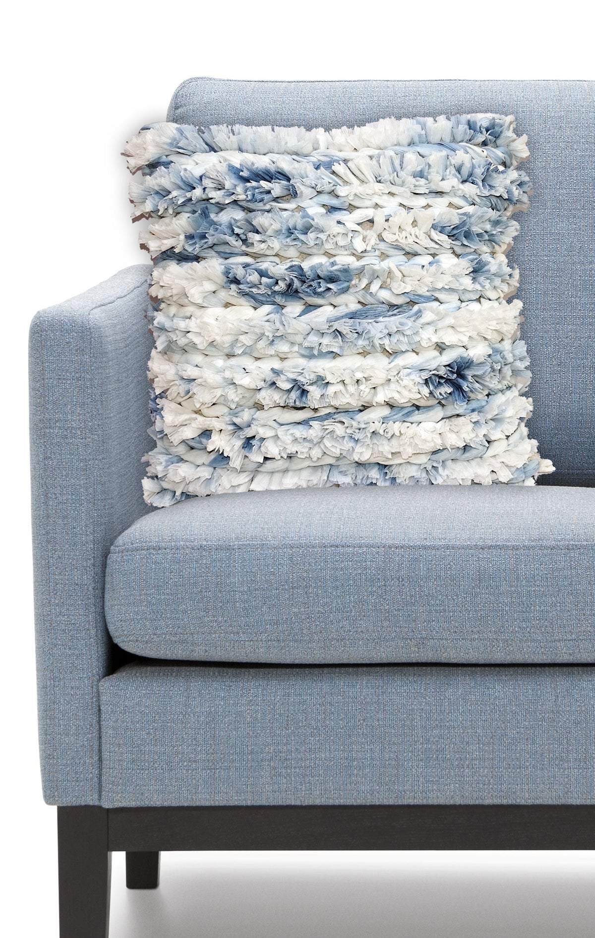 Vibhsa blue white furry throw pillow 22x22 with shag texture on blue upholstered sofa on Tampa Home & Garden Store