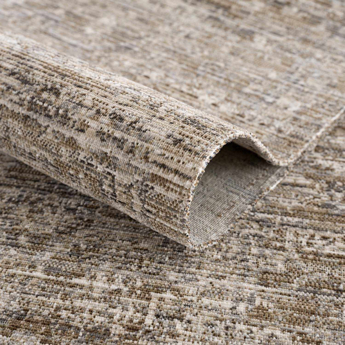 Uzuri washable outdoor area rug beige-brown distressed pattern with rolled edge on Tampa Home & Garden Store