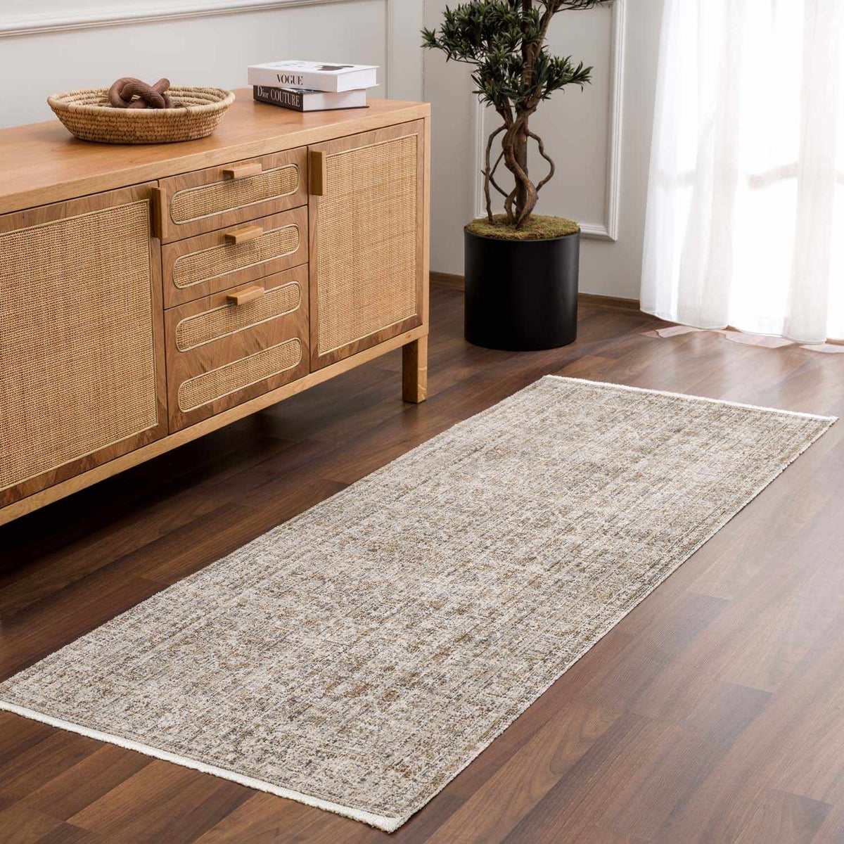 Uzuri washable outdoor area rug runner in beige with textured pattern on wood floor on Tampa Home & Garden Store