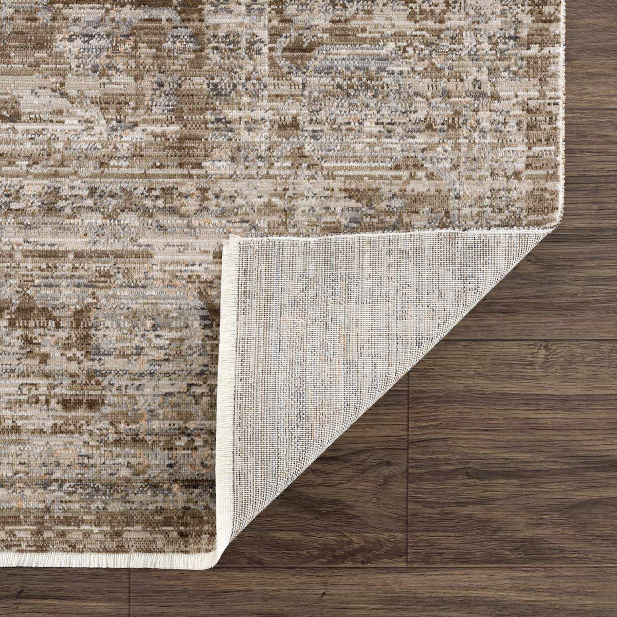 Aistys washable outdoor area rug by Boutique Rugs in beige distressed pattern with rolled corner on Tampa Home & Garden Store