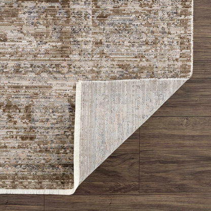 Aistys washable outdoor area rug by Boutique Rugs in beige distressed pattern with rolled corner on Tampa Home & Garden Store
