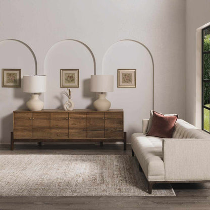 Aistys washable outdoor area rug in beige with texture, shown in a living room on Tampa Home & Garden Store