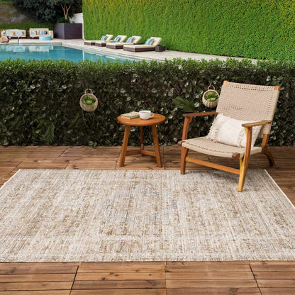 Aistys Washable Outdoor Area Rug by Boutique Rugs, neutral beige woven rug on wooden deck on Tampa Home & Garden Store