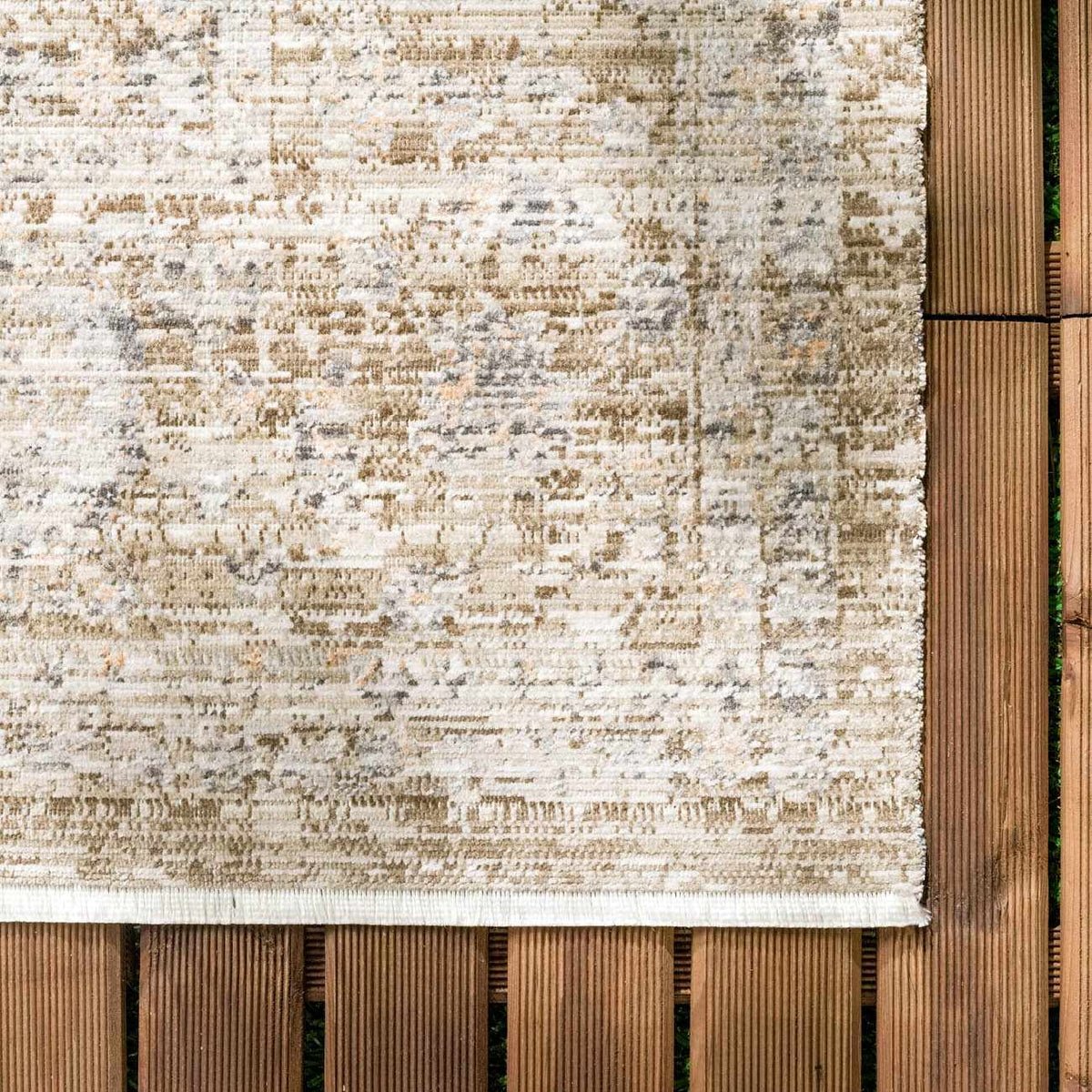 Aistys washable outdoor area rug beige taupe distressed pattern on deck Boutique Rugs on Tampa Home & Garden Store
