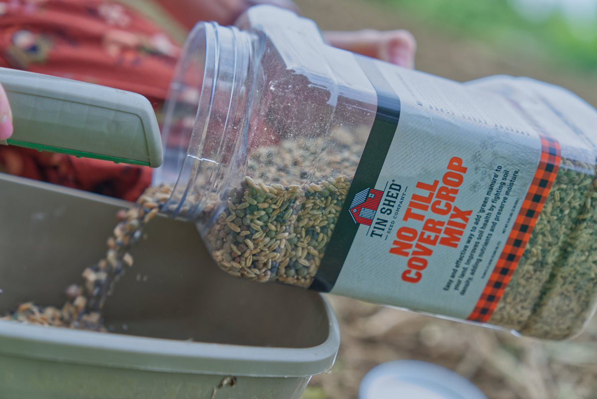 No Till Cover Crop Mix seeds Tin Shed Seed Company poured from a bag into a tray on Tampa Home & Garden Store