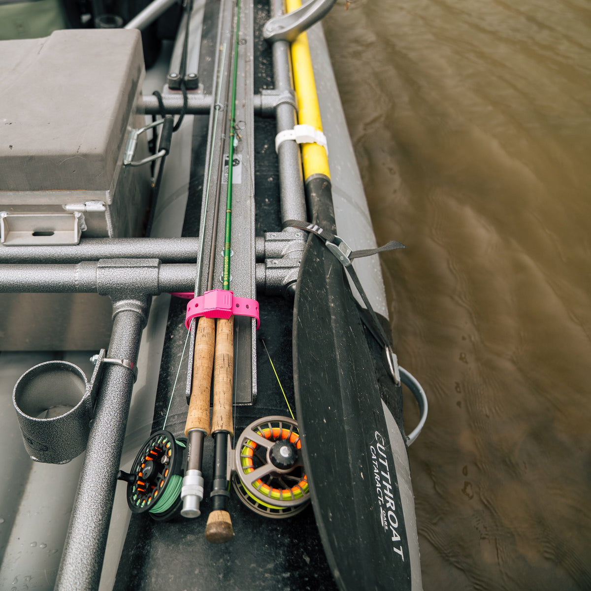 Hoss Straps Gear Straps 12-Inch pink strap secures fishing rods on a boat deck on Tampa Home & Garden Store