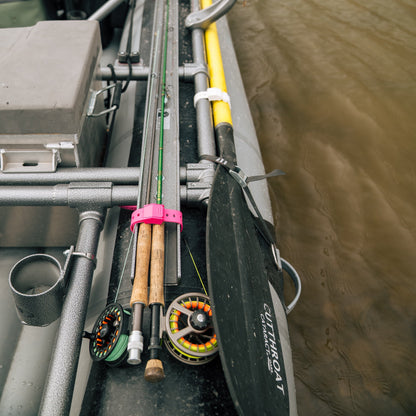 Hoss Straps Gear Straps 12-Inch pink strap secures fishing rods on a boat deck on Tampa Home & Garden Store