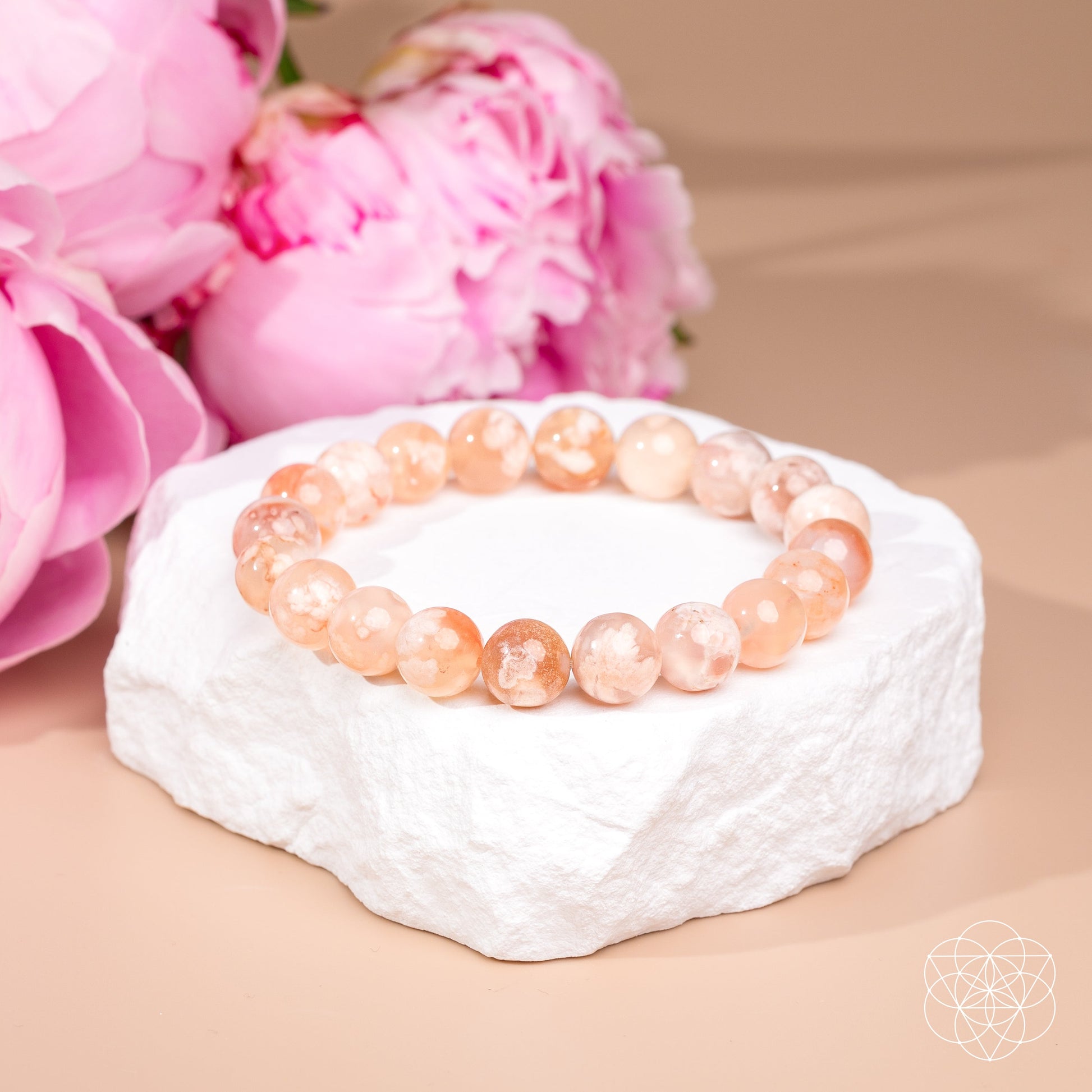 Bracelet The Woman You’re Becoming Sakura Flower Agate peach beads Conscious Items with pink floral backdrop on Tampa Home & Garden Store