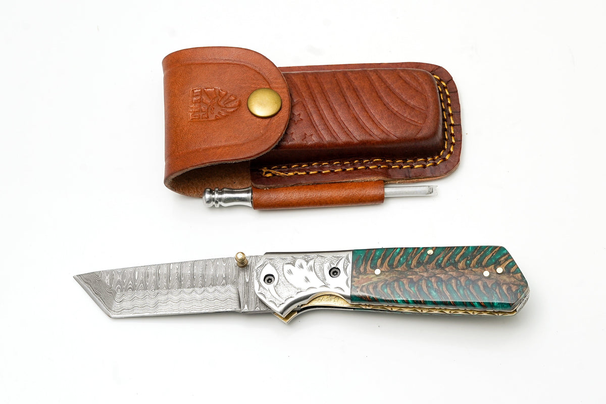 Damascus steel tanto folding knife with bolster and green pine cone handle; sharpening rod on Tampa Home & Garden Store