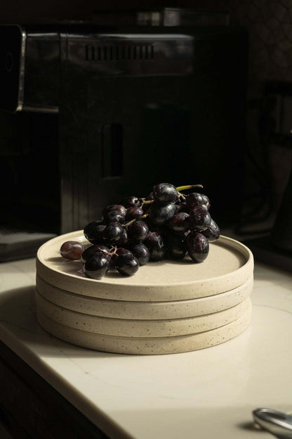Handmade stoneware plate white with speckles, grapes atop stack by CREATING COMFORT on Tampa Home & Garden Store