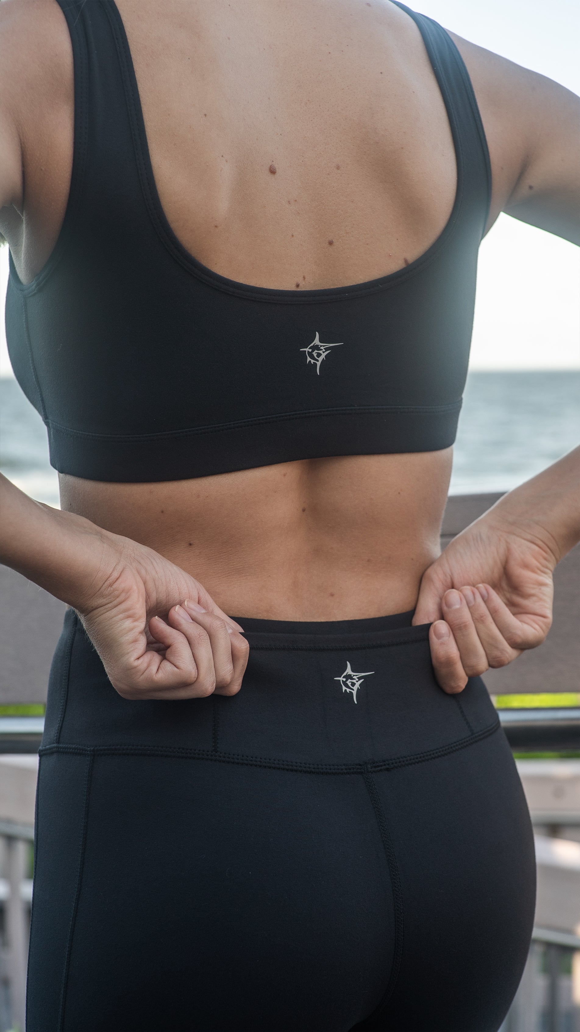HydroFlex Cut Out Leggings by White Water Life in black with small logo on hip on Tampa Home & Garden Store