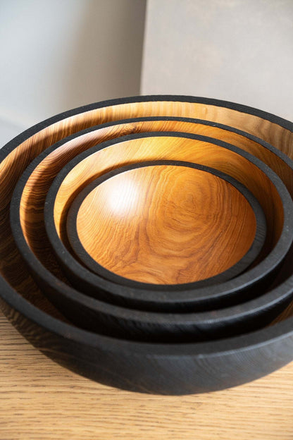 Hand carved extra large wooden fruit bowl with half-charred rims, nesting serving bowls on Tampa Home & Garden Store