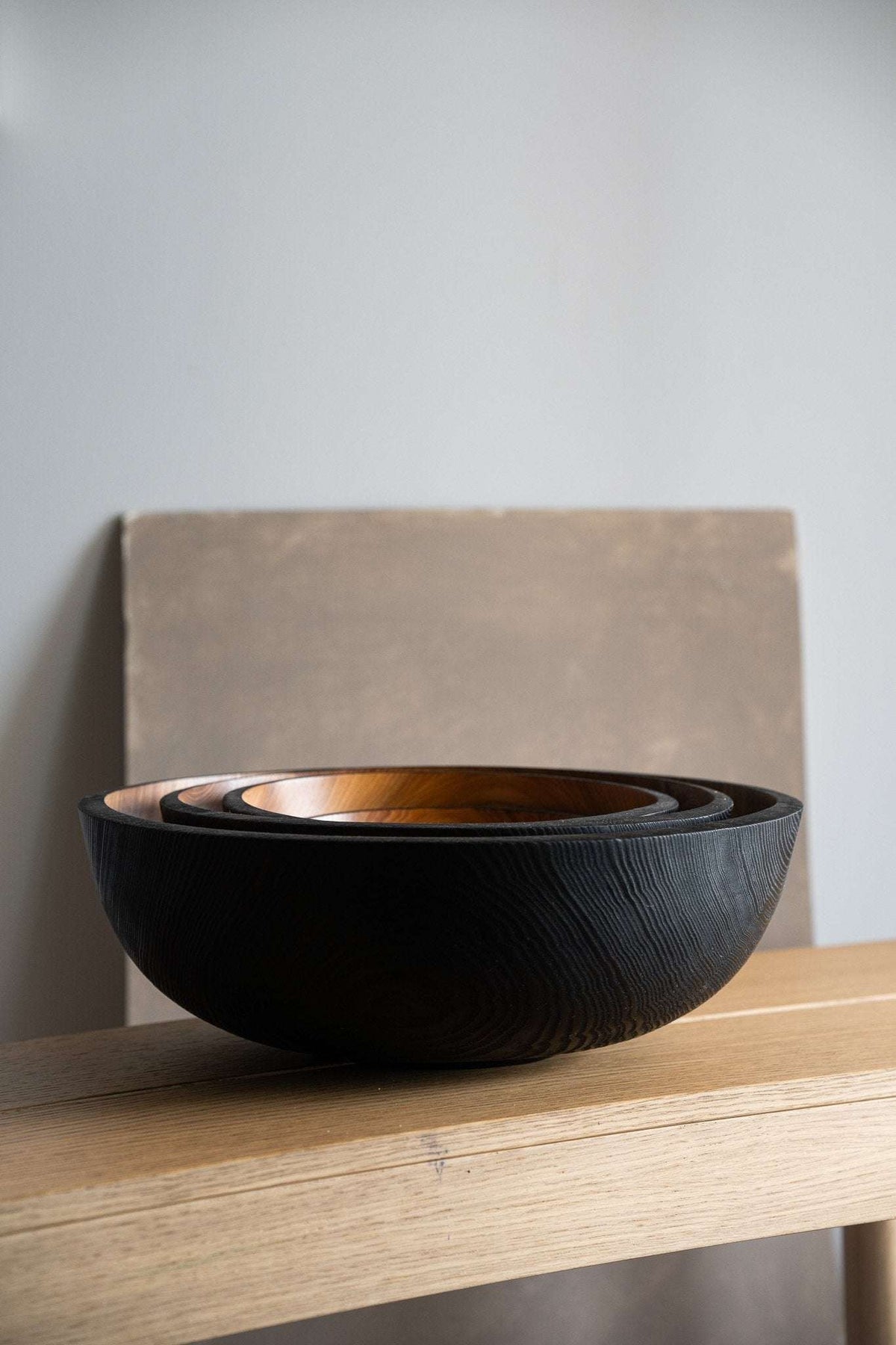 Hand carved large wooden fruit bowl half charred black exterior warm interior serving bowl on Tampa Home & Garden Store