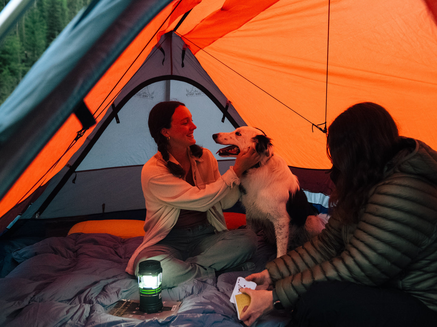 Sky View XL Tent interior with people and a dog in orange fabric on Tampa Home & Garden Store
