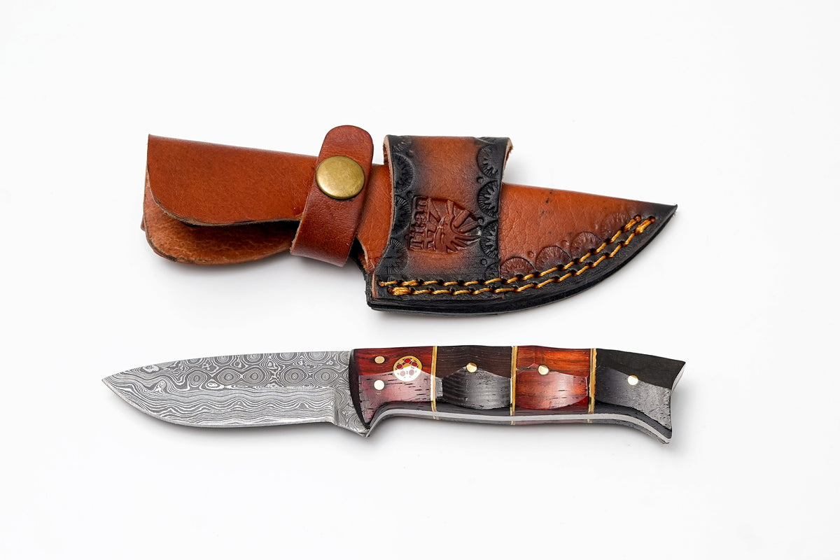 Damascus drop point hunter knife with rosewood-ebony handle in a brown leather sheath with brass snap on Tampa Home & Garden Store