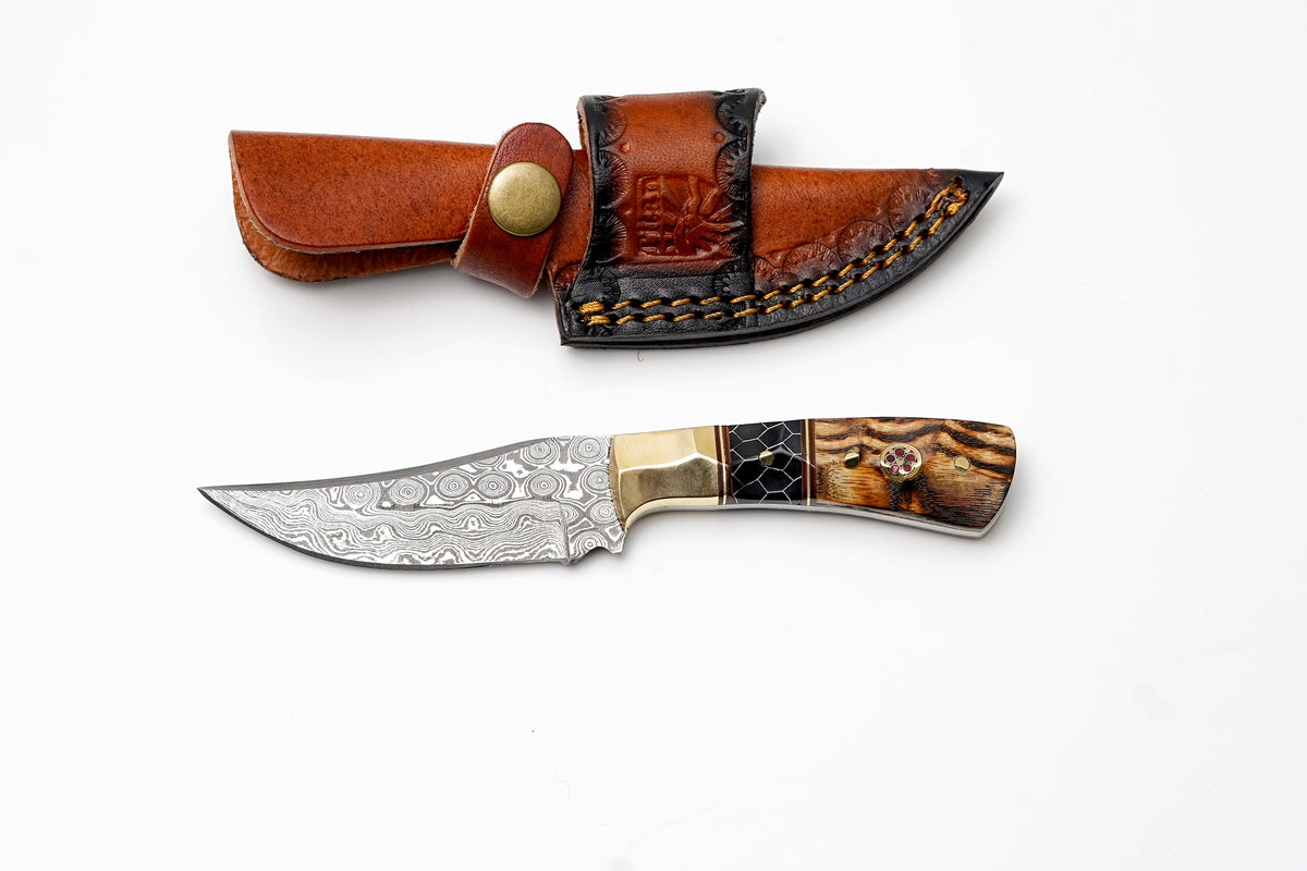 Damascus trailing-point hunter knife with brass bolster and wood honeycomb handle in sheath on Tampa Home & Garden Store
