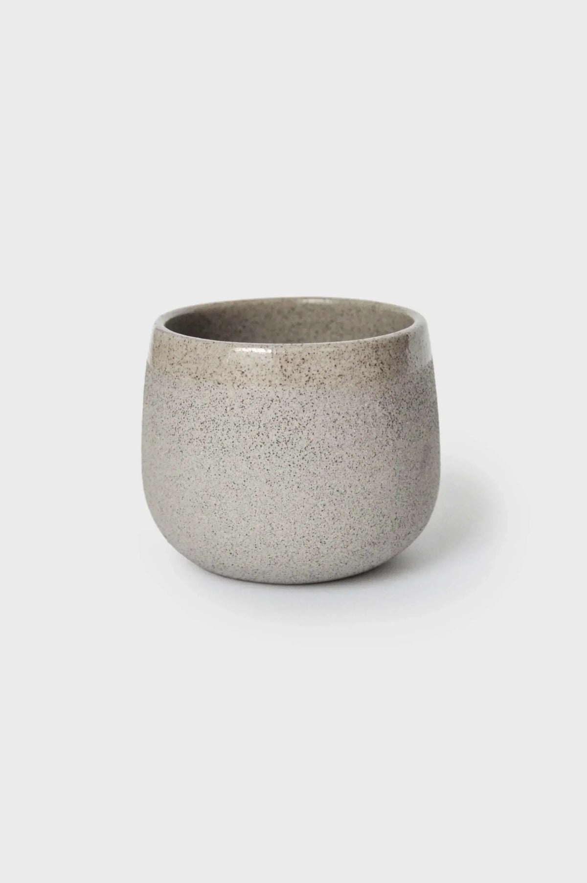 Handmade stoneware coffee cup in speckled concrete glaze, gray-beige finish on Tampa Home & Garden Store