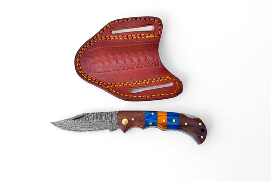 Damascus steel pocket knife with blue/orange wood scales and brown leather sheath on Tampa Home & Garden Store