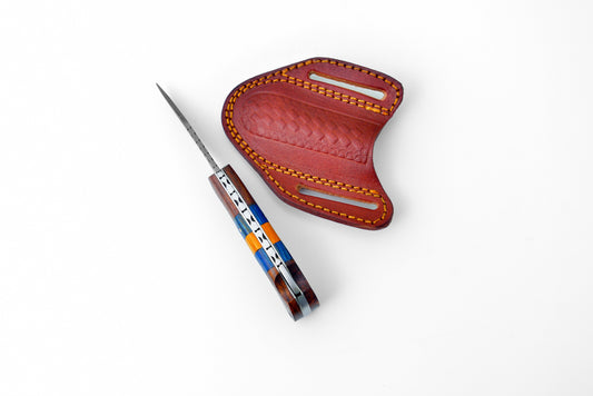 Damascus steel pocket knife TF-058 with striped wooden handle beside red leather sheath on Tampa Home & Garden Store