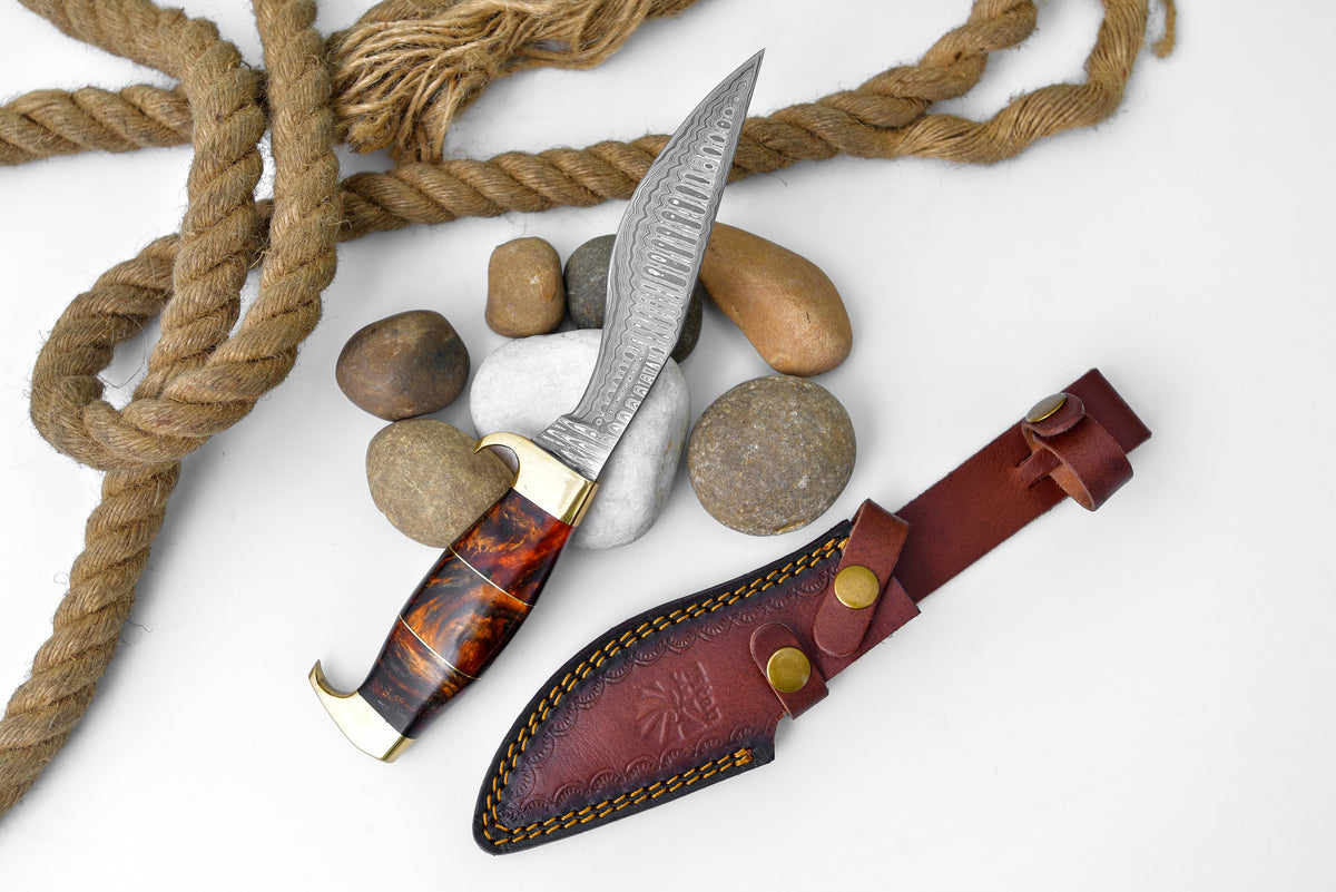 Damascus Galaxy outdoor chopping tool with orange resin brass handle, damascus blade, sheath on Tampa Home & Garden Store