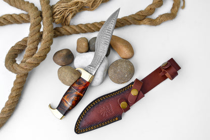Damascus Galaxy outdoor chopping tool with orange resin brass handle, damascus blade, sheath on Tampa Home & Garden Store