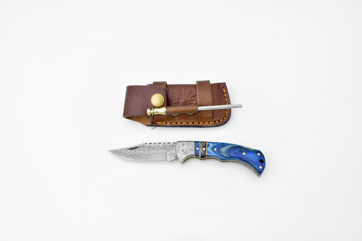 TF-049 Damascus bolster knife with belt clip in leather sheath; blue handle visible on Tampa Home & Garden Store