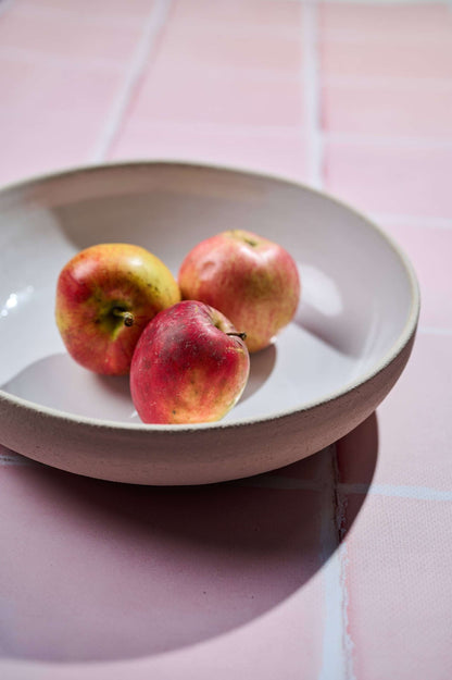 Handmade Stoneware Pasta Bowl CREATING COMFORT with pink glaze exterior and white interior on Tampa Home & Garden Store