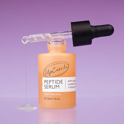 Peptide Serum bottle by UpCircle orange dropper with custard apple + blood orange on Tampa Home & Garden Store