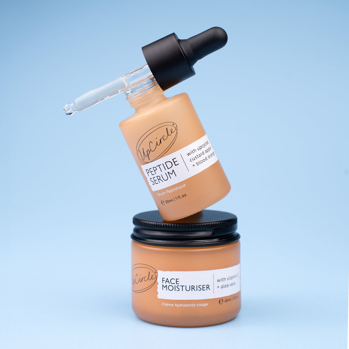UpCircle Elasticity Boosting Duo face serum bottle with dropper and peach tint on Tampa Home & Garden Store