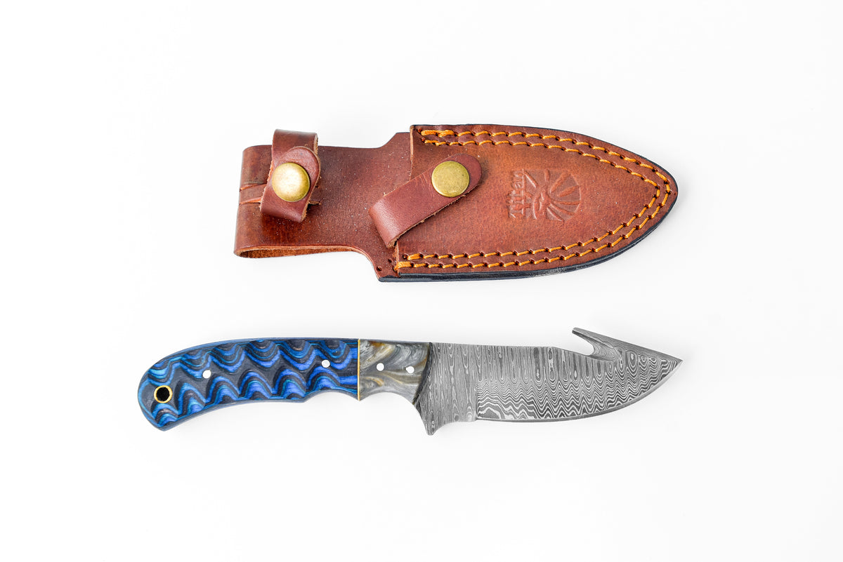 Damascus Steel Gut-hook TK-112 knife with blue-patterned handle and brown leather sheath on Tampa Home & Garden Store