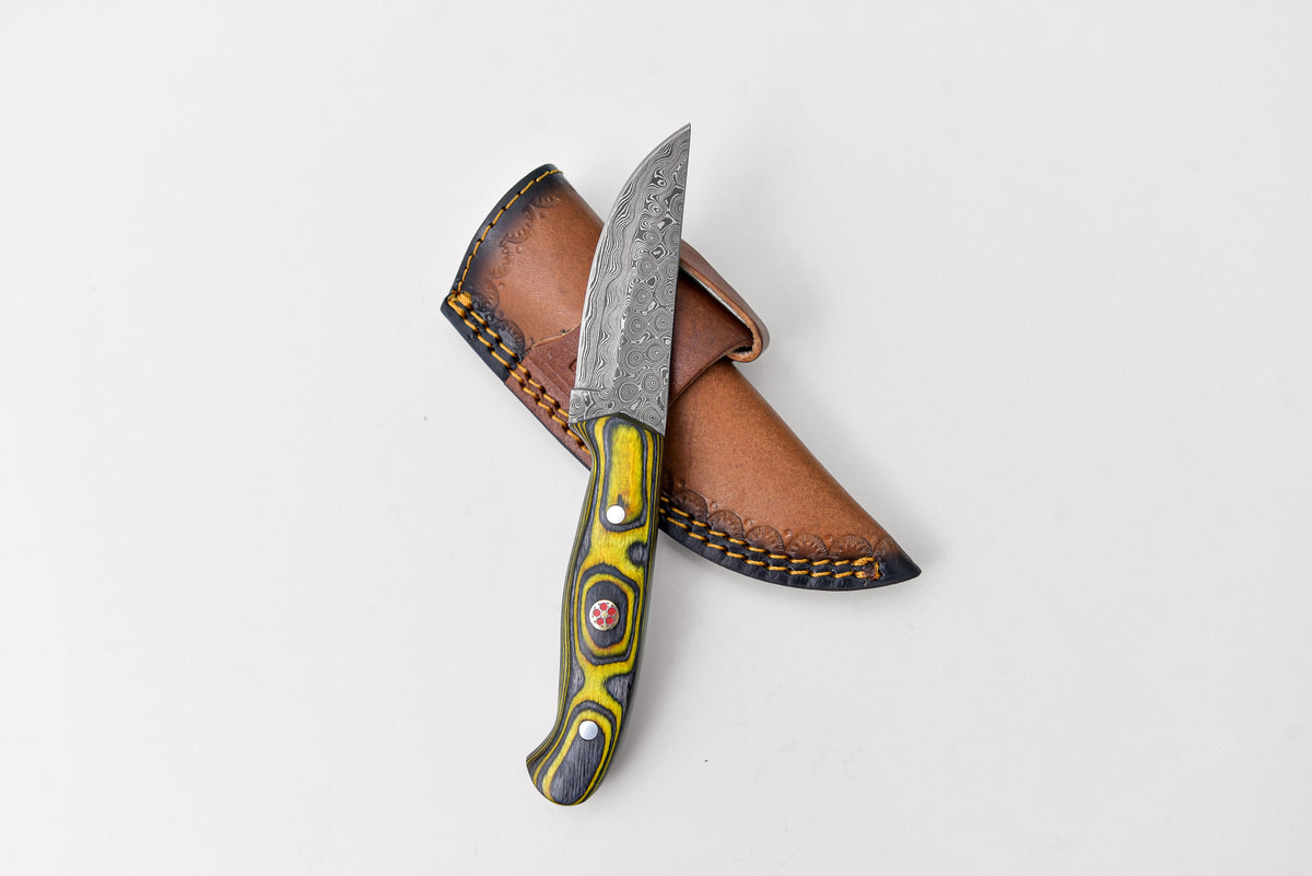 Custom Titan Pointer Damascus knife with patterned blade and yellow-green handle in brown stitched leather sheath on Tampa Home & Garden Store
