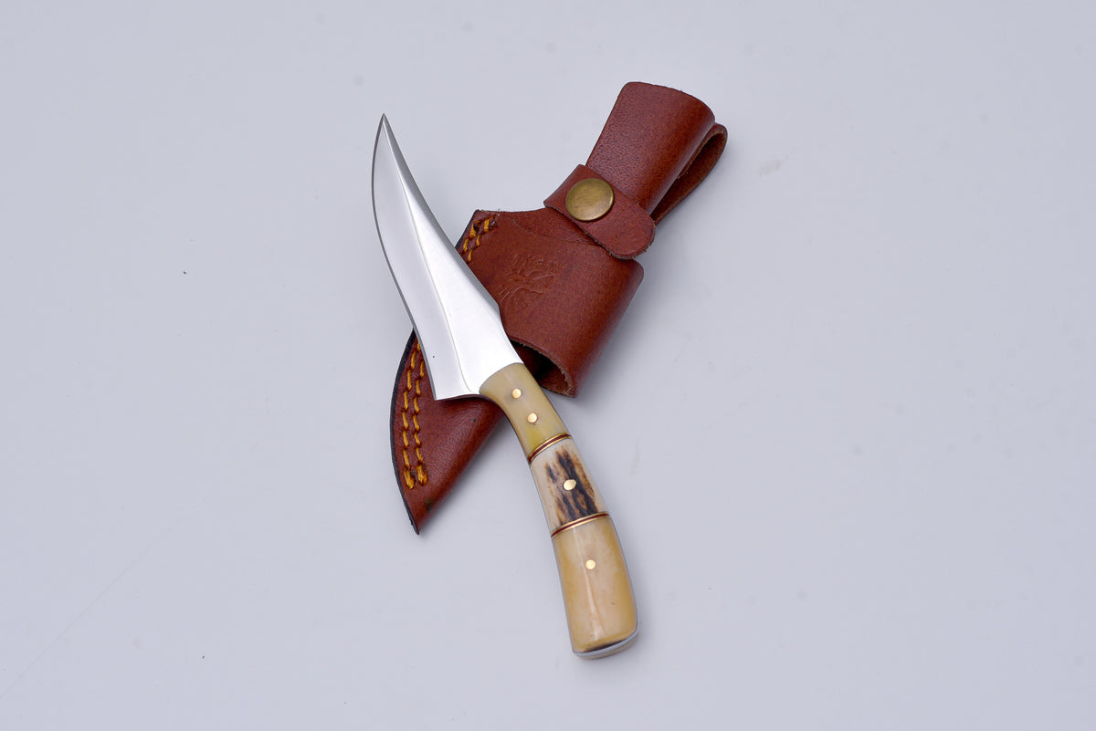 Titan Wayfarer hunting knife with curved blade, bone handle, brass rivets in leather sheath on Tampa Home & Garden Store