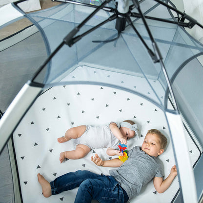 Pop 'N Go Playpen with gray mesh sides and white padded floor with two kids inside on Tampa Home & Garden Store