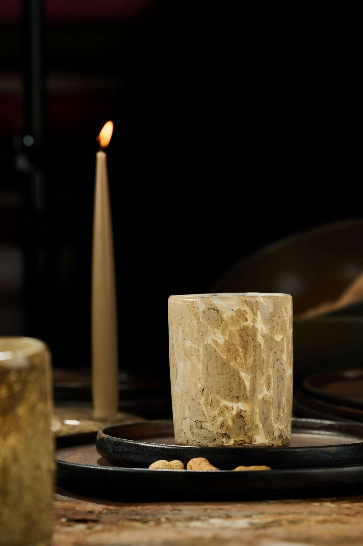Hand Blown Glass Tumbler cream marble by CREATING COMFORT; candlelit on a dark tray on Tampa Home & Garden Store