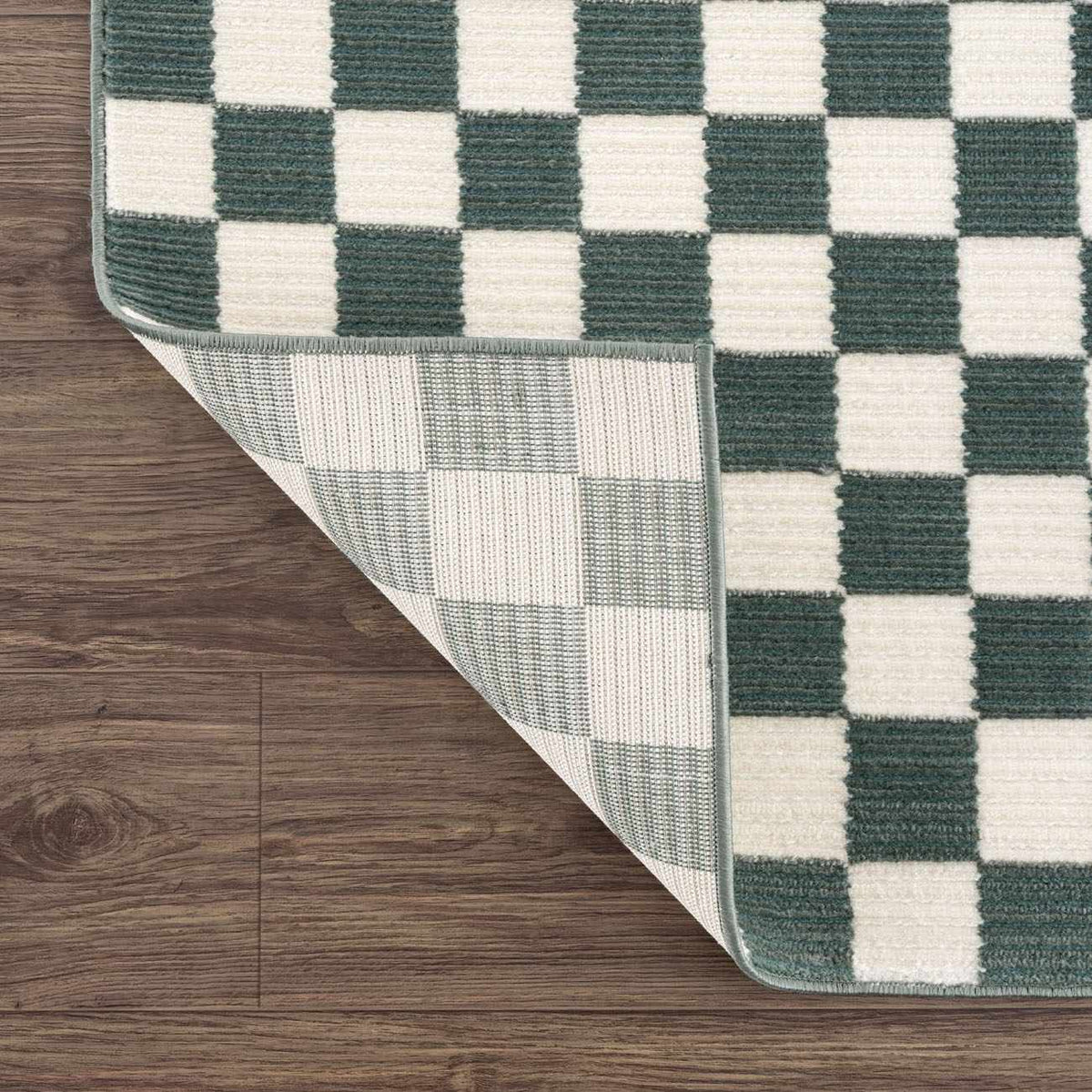 Kaysar Oil Green Checkered Washable Area Rug by Boutique Rugs, bound edge on wood floor on Tampa Home & Garden Store