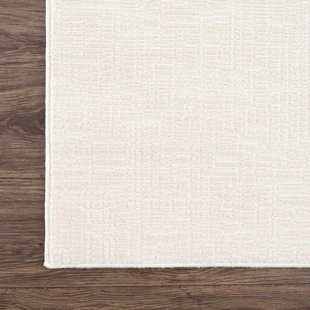 Leanna Cream Washable Rug, cream textured surface, bound edges, Boutique Rugs on wood floor on Tampa Home & Garden Store