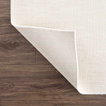 Leanna Cream Washable Area Rug by Boutique Rugs, cream tone with white backing on wood floor on Tampa Home & Garden Store