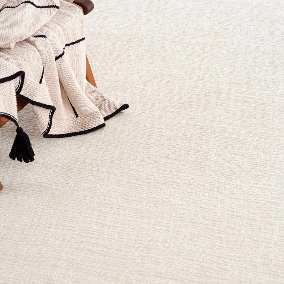 Leanna Cream Washable Area Rug by Boutique Rugs, cream with navy border and tassels on Tampa Home & Garden Store