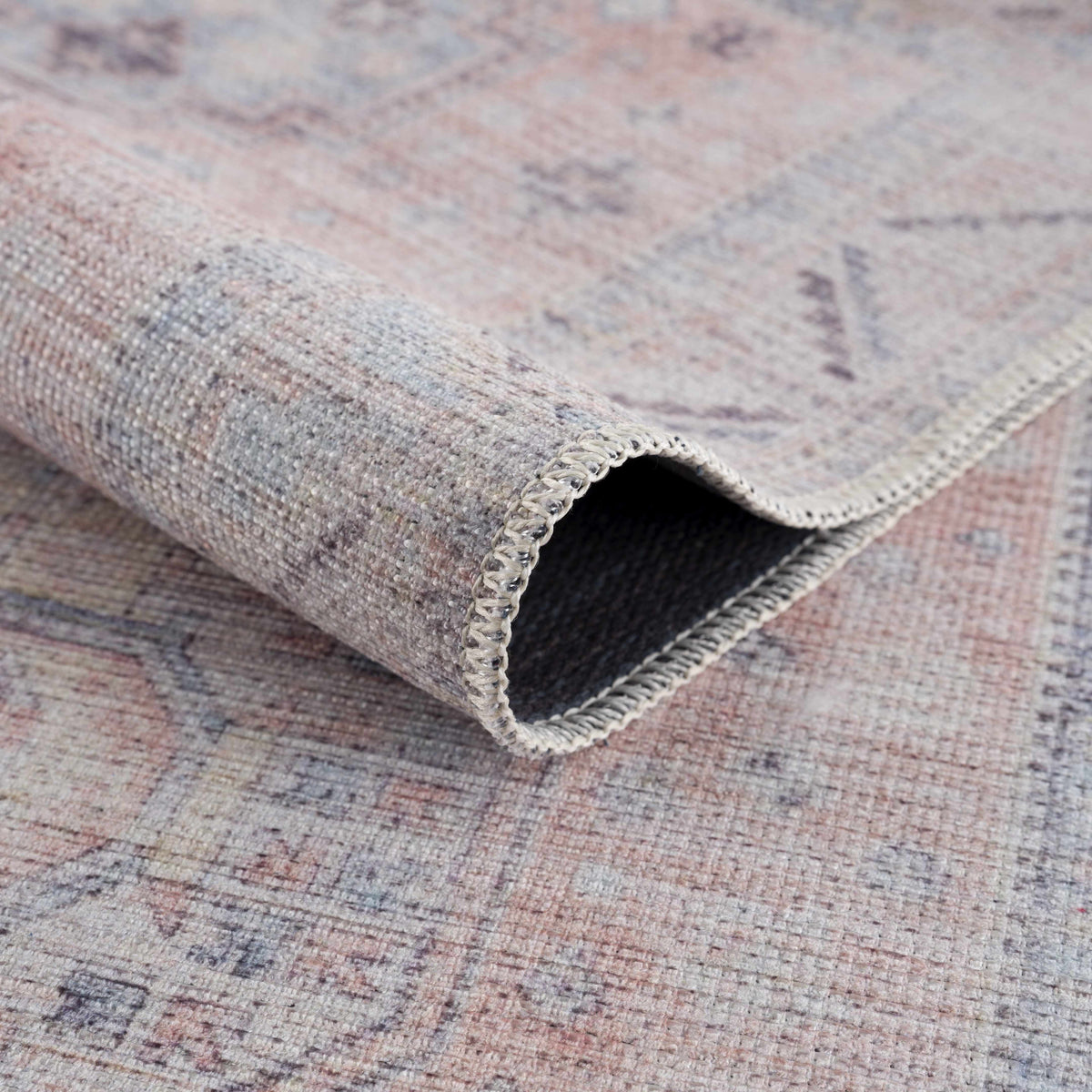 Morcott Peach Washable Area Rug by Boutique Rugs, woven edge in peach gray tones on Tampa Home & Garden Store