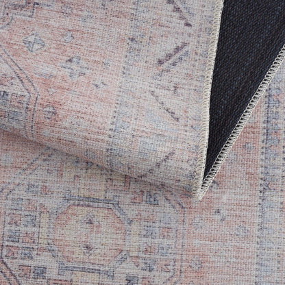 Morcott Peach Washable Area Rug with distressed pattern and beige edge stitching on Tampa Home & Garden Store