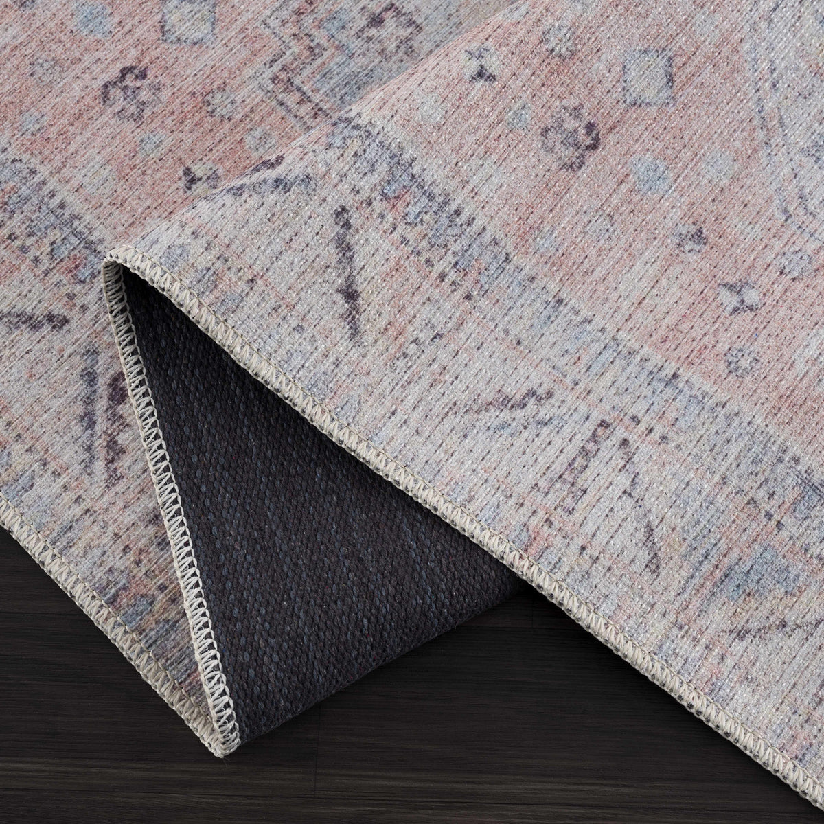 Morcott Peach Washable Area Rug in peach tones with blue-gray, woven texture and binding on Tampa Home & Garden Store