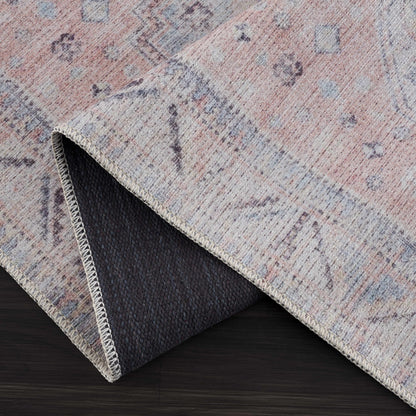 Morcott Peach Washable Area Rug in peach tones with blue-gray, woven texture and binding on Tampa Home & Garden Store