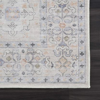 Beige Beckett Washable Rug with vintage-inspired pattern and white border Boutique Rugs on Tampa Home & Garden Store