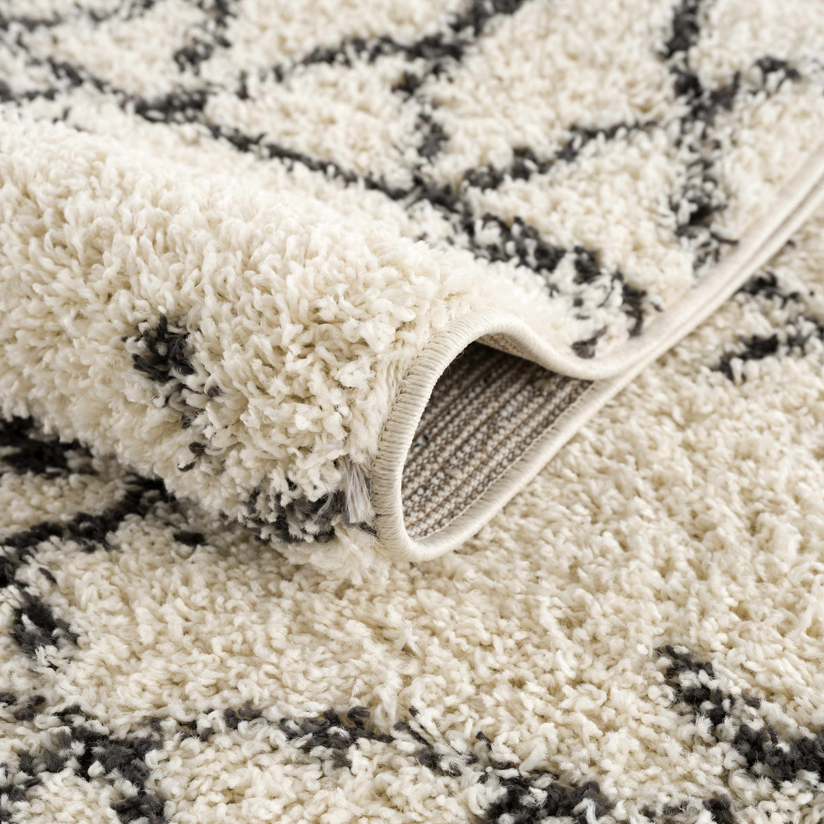 Emlenton Berber Shag rug with tassels in ivory and charcoal by Boutique Rugs on Tampa Home & Garden Store