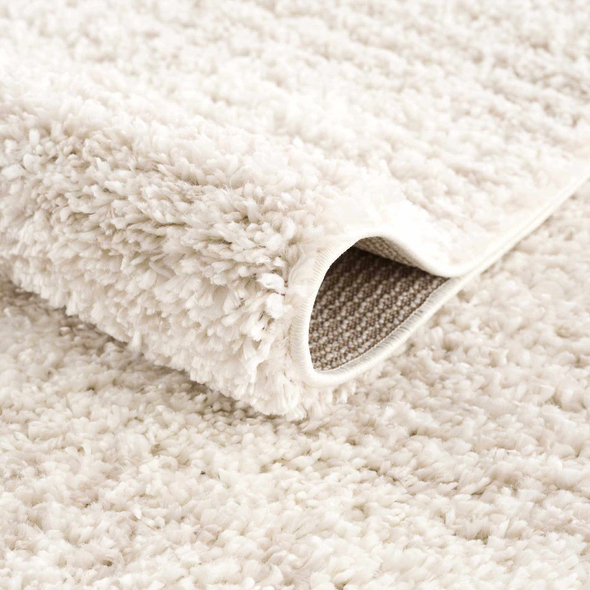 Hauteloom Trunding Plush Rug light beige with fluffy pile and bound edge on Tampa Home & Garden Store