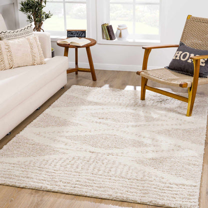 Hauteloom Trunding Plush Rug by Boutique Rugs, light beige shag in a living room with sofa on Tampa Home & Garden Store