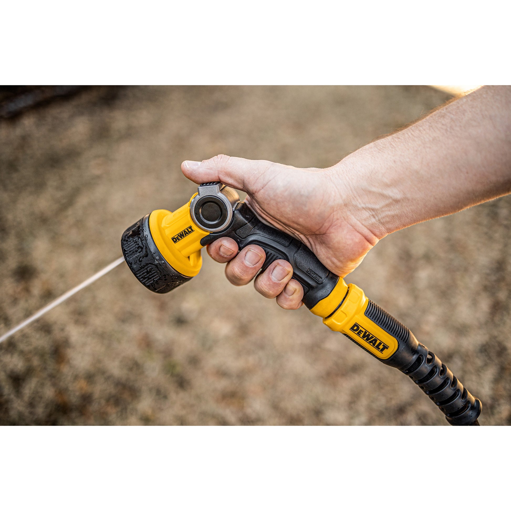 DEWALT Pattern Pro Thumb Control Turret Nozzle DXWN3288 hose end black grip in hand on Tampa Home & Garden Store